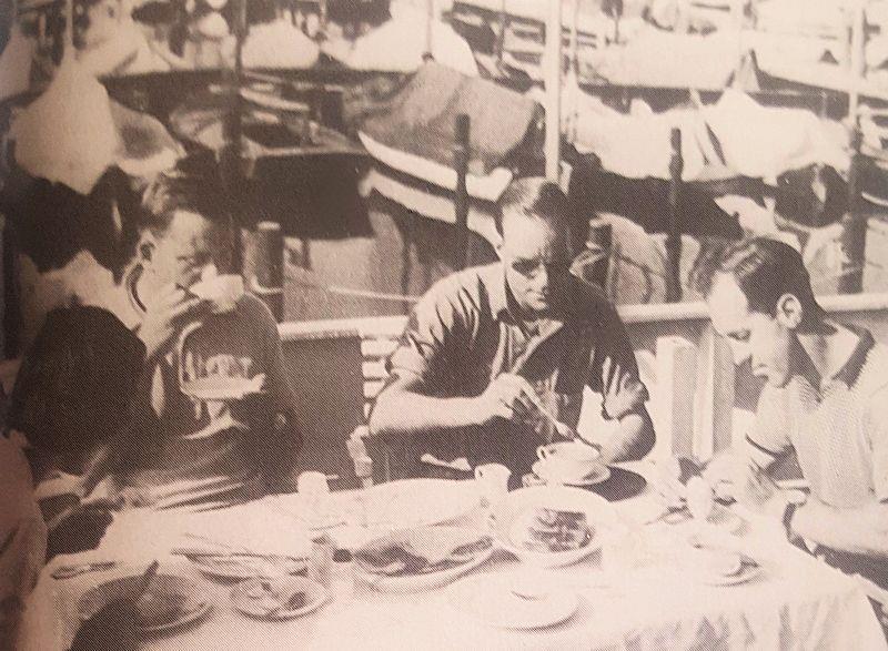 Charles Currey (with cup to lips) and International 14 friends discussing the shape of a future performance dinghy which would become the FD - photo © Austin Farrar Collection / David Chivers