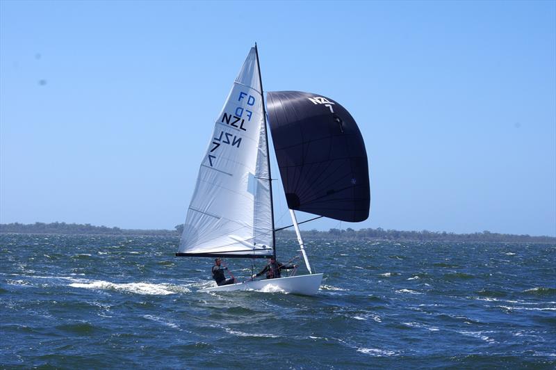 Mark Henger and Matt Bismark on PPK NZL7 surfing the waves to the finish line in race four of the Flying Dutchman 2026 Australian Championship - photo © Jeanette Severs