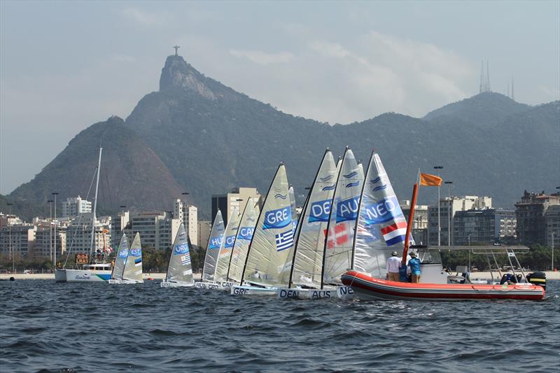 Finn class Race 1 starts at the Rio 2016 Olympic Sailing Competition photo copyright Robert Deaves taken at  and featuring the Finn class