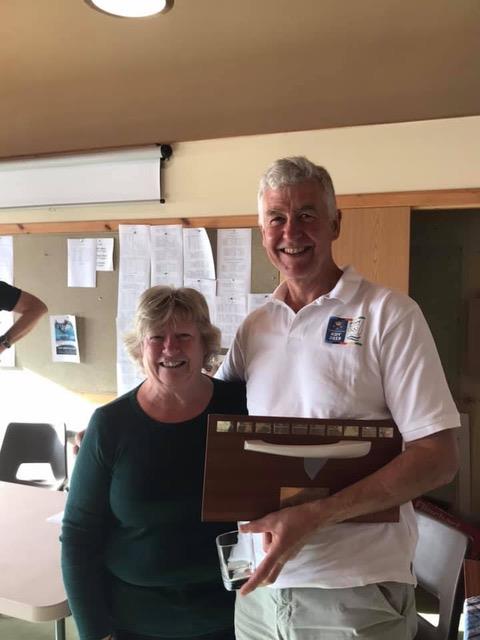 Scottish Finn Championships winner John Colgreve presented with the Finn trophy by Jacquie Tosh, wife of Club Commodore Lindsay during the Solway Yacht Club Championship weekend photo copyright Anne-Marie Williams taken at Solway Yacht Club and featuring the Finn class