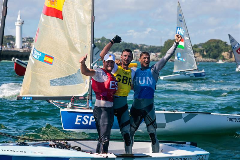 Finn class medallists (l-r) Joan Cardona (ESP) bronze, Giles Scott (GBR) gold, Zsombor Berecz (HUN) silver at the Tokyo 2020 Olympic Sailing Competition photo copyright Sailing Energy / World Sailing taken at  and featuring the Finn class