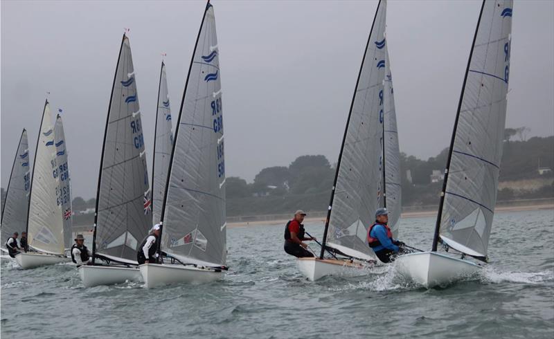 Finn Travellers at Highcliffe photo copyright Sarah Desjonqueres taken at Highcliffe Sailing Club and featuring the Finn class