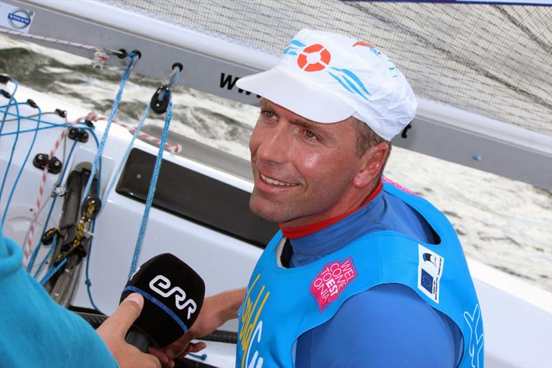 Ed Wright interviewed on the water after the 2013 Finn Gold Cup Medal Race photo copyright Robert Deaves taken at Kalev Yacht Club and featuring the Finn class