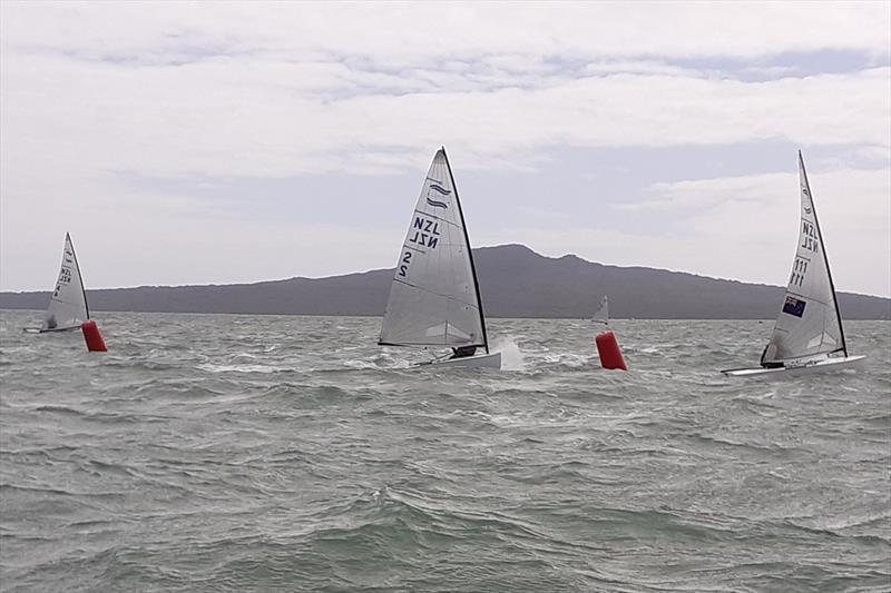 Karl leads Ray through the gate, Mark already charging back upwind with Tom in the background photo copyright Garth Bride taken at  and featuring the Finn class