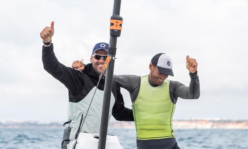 Berecz celebrates with coach Mateusz Kusznierewicz - 2021 Open and U23 Finn European Championship photo copyright Joao Costa Ferreira taken at  and featuring the Finn class