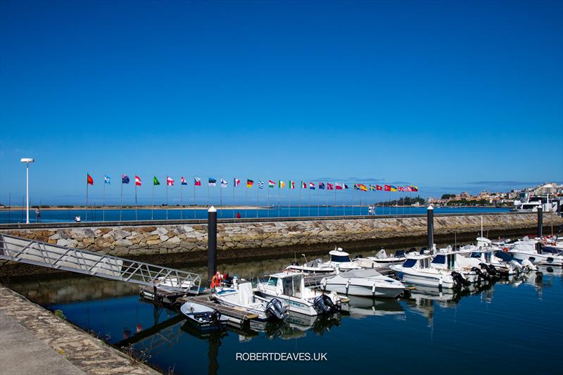 Competing countries flags fly high - Finn Gold Cup - Porto, Portugal - May 2021 photo copyright Robert Deaves / Finn Class taken at Vilamoura Sailing and featuring the Finn class