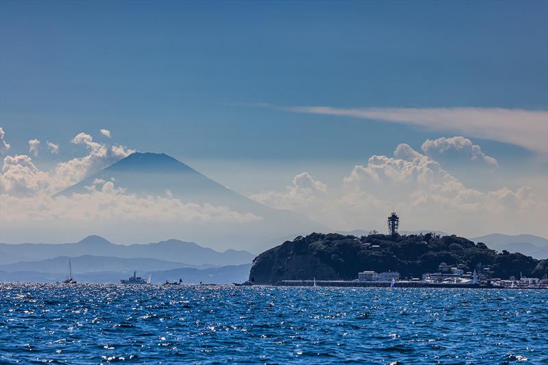 Enoshima with Mount Fuji watching over the field of play - Tokyo 2020 photo copyright Sailing Energy / World Sailing taken at  and featuring the Finn class