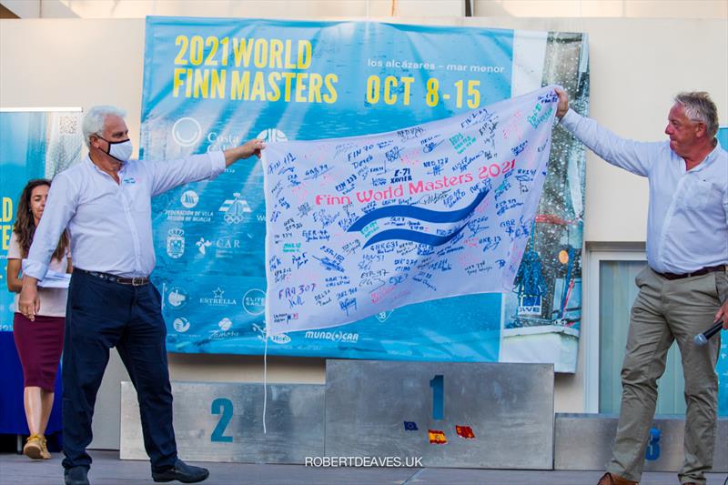 FVRM President Arturo Antonio Garcia Pallares receives the Finn flag signed by all competitors by the Masters President Andy Denison - 2021 Finn World Masters photo copyright Robert Deaves taken at  and featuring the Finn class