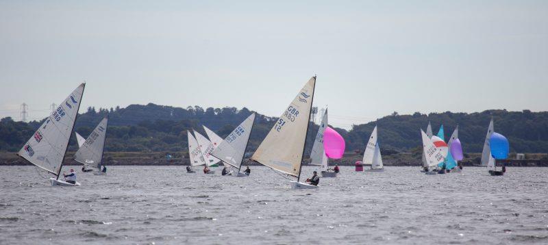 Russ Ward leads the fleet, pursued by David Kitchen - Finn Traveller and Scottish Championship during the Largs Regatta 2022 photo copyright Marc Turner / www.pfmpictures.co.uk taken at Largs Sailing Club and featuring the Finn class