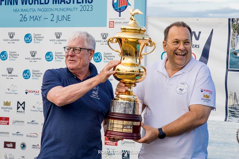 Peter Vollebregt, the Masters Cup and Vasilis Pigadas on day 1 of the 2023 Finn World Masters in Greece photo copyright Robert Deaves / www.robertdeaves.uk taken at  and featuring the Finn class