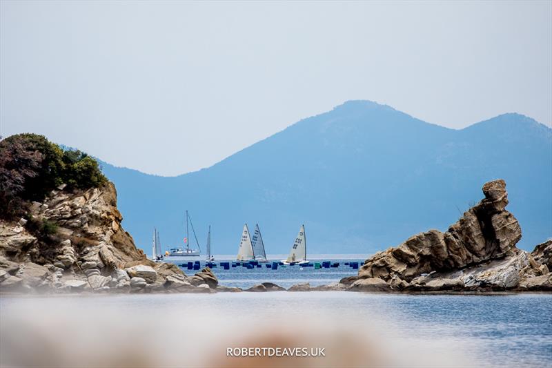 Sailing in some amazing scenery - Day 2 of the 2023 Finn World Masters in Greece photo copyright Robert Deaves / www.robertdeaves.uk taken at  and featuring the Finn class