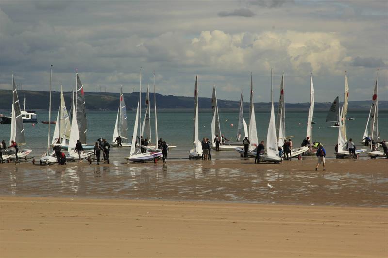 Fireballs launching from the beach at Tenby in 2014 photo copyright UKFA taken at Tenby Sailing Club and featuring the Fireball class