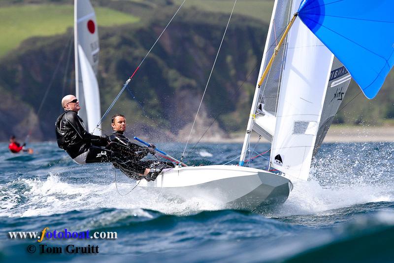 Action from the Fireball National Championships photo copyright Tom Gruitt / www.fotoboat.com taken at Pentewan Sands Sailing Club and featuring the Fireball class