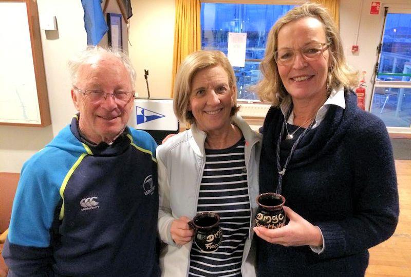 PY Mug winners in race 1, Louise McKenna & Hermine O'Keeffe with commodore Frank Guilfoyle, on day 4 of the Dun Laoghaire MYC Frostbite Series photo copyright Frank Miller taken at Dun Laoghaire Motor Yacht Club and featuring the Fireball class
