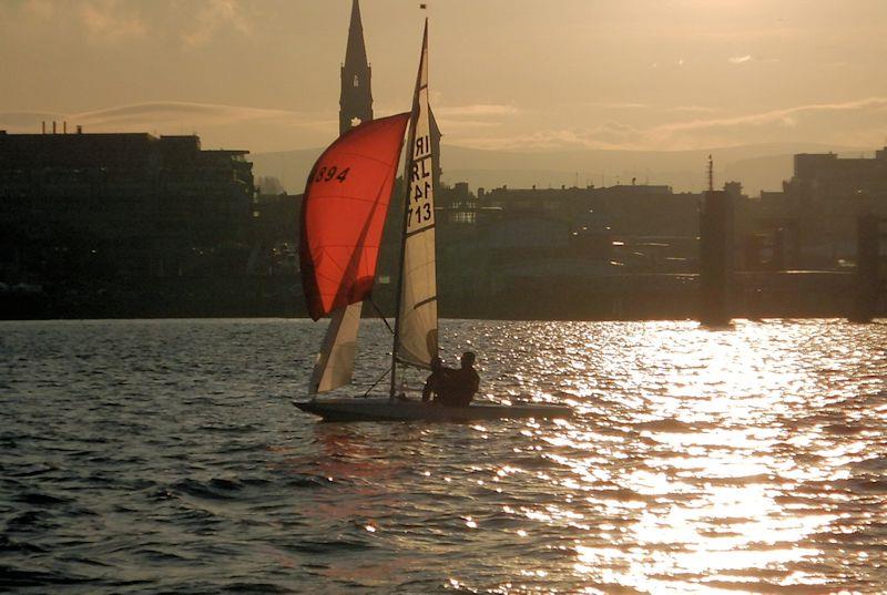 Dun Laoghaire Frostbite Series day 5 - Frank Miller & Grattan Donnelly almost silhouetted in the winter sunshine photo copyright Cormac Bradley taken at Dun Laoghaire Motor Yacht Club and featuring the Fireball class