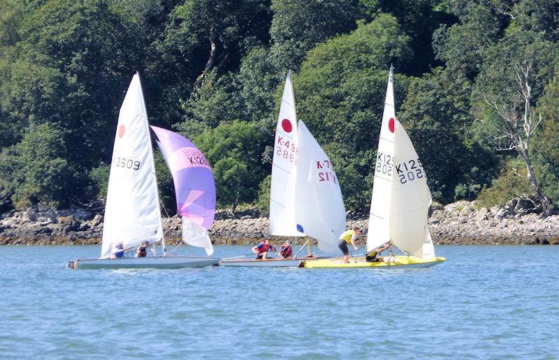 The battle of the Fireballs! The three crews were in close competition throughout Kippford Week 2022; Jack Jardine and James Kelly lead James Bishop and Alex Lammie followed by Ellie Rowand and Lilli Bell photo copyright Becky Davison taken at Solway Yacht Club and featuring the Fireball class