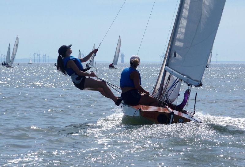 Lilli Bell trapezing in the sunshine, out on the Fireball's wire, heading out in the Fast handicap race during Kippford Week 2022 - photo © Becky Davison