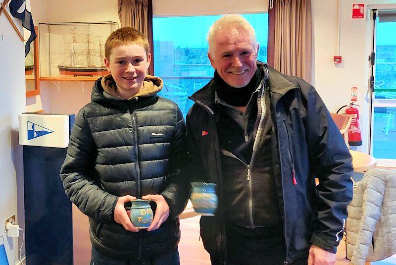 Hugh and Frank Cassidy collect their Frostbite Mugs - Viking Marine DMYC Frostbite Series 2 day 3 photo copyright Cormac Bradley taken at Dun Laoghaire Motor Yacht Club and featuring the Fireball class