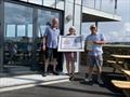 Ultraviolet's Peter Stephens and Tom Laity (together with Gaye Slater, Flushing SC Commodore) retain their trophy from 2019 in the 2021 Firebird Championship at Flushing Sailing Club © www.kitesurfkit.com