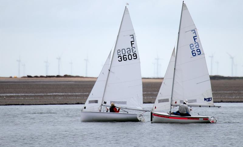 Chris Kameen & Anna Leddingham chasing Marian & Angus Armstrong during the West Kirby Firefly Open photo copyright Alan Jenkins taken at West Kirby Sailing Club and featuring the Firefly class