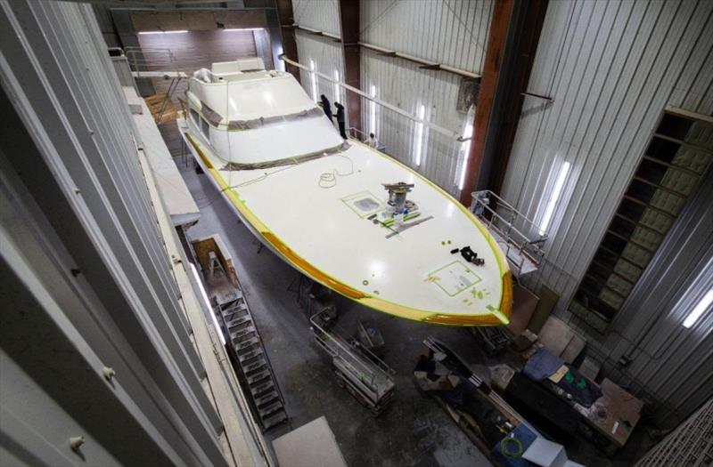 Work begins on the faux teak toe rail - Bayliss 75' - photo © Bayliss Boatworks