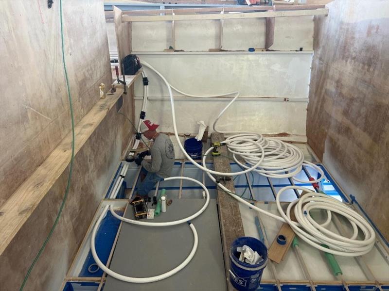 Craig installing Hull #7 refrigerant lines photo copyright Michael Rybovich & Sons taken at  and featuring the Fishing boat class