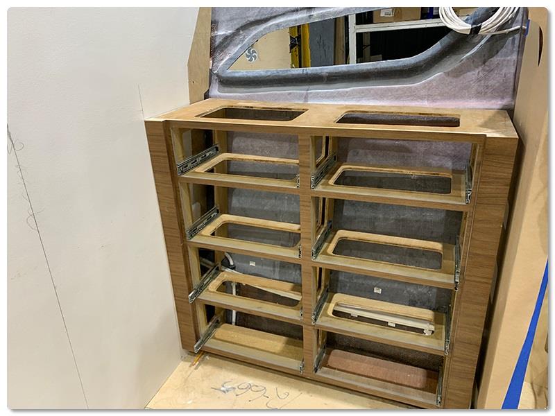 Installing a credenza in the owner's stateroom of a Viking 72 - photo © Viking Yachts