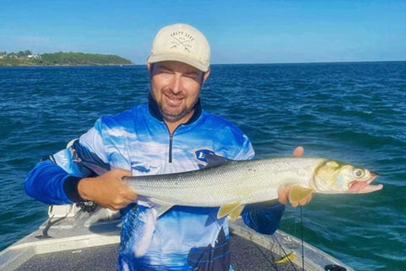 Deej with one of our premier sport fish, the ladyfish or giant herring. You need some sunnies mate. We sell all the best by the way - photo © Fisho's Tackle World