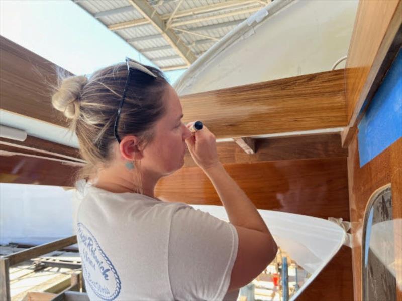 Hull #8 - Cheryl Ann varnishing hatch combing - photo © Michael Rybovich & Sons