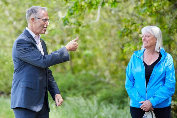 U.S. Rep Jared Huffman speaks with Janet Coit, Assistant Administrator for NOAA Fisheries, at the award presentation. The site was adjacent to habitat slated for restoration photo copyright Katja Bresch taken at  and featuring the Fishing boat class
