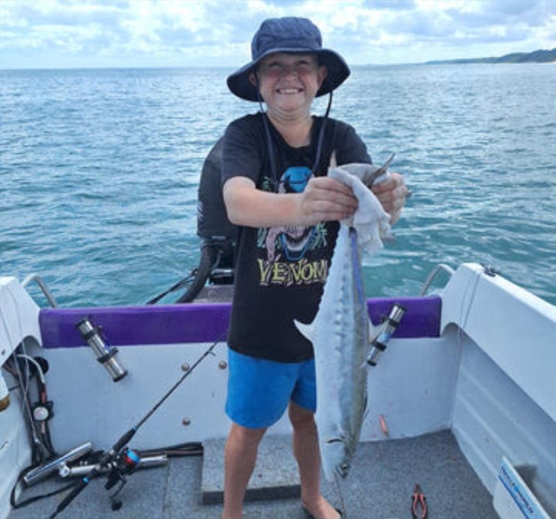 Alexander was very happy with this mackerel. They are in the bay in bigger numbers now so go get into them - photo © Fisho's Tackle World