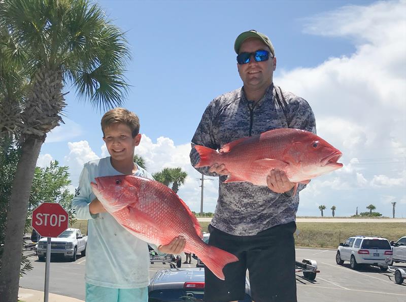 Two fishermen holding red snapper. Photo submission for NOAA Fisheries Southeast Fishing Photo Contest - photo © NOAA Fisheries