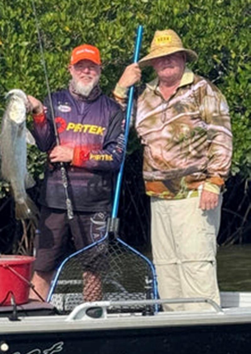 Jerry and mate with a local barra. Recent flooding will have them on the move and on the feed - photo © Fisho's Tackle World