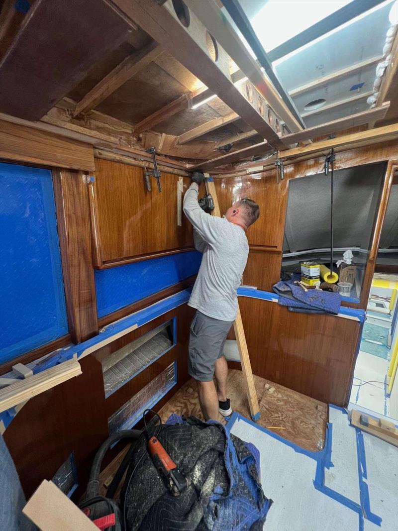 Hull #9 - Thomas installing overhead molding - photo © Michael Rybovich & Sons