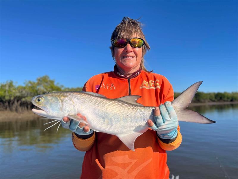 Erica with an example of the blue salmon that are so prolific in our streams and on our flats these days - photo © Fisho's Tackle World Hervey Bay