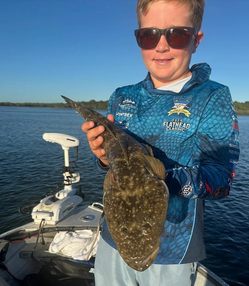 Flathead don't stand a chance when Ollie is nearby flicking lures photo copyright Fisho's Tackle World Hervey Bay taken at  and featuring the Fishing boat class