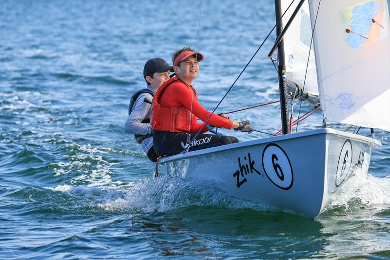 Aidan Nosworthy second in R2 on Zhik Combined High Schools (CHS) Sailing Championships Day 1 photo copyright Red Hot Shotz Sports Photography / Chris Munro taken at Belmont 16ft Sailing Club and featuring the Flying 11 class
