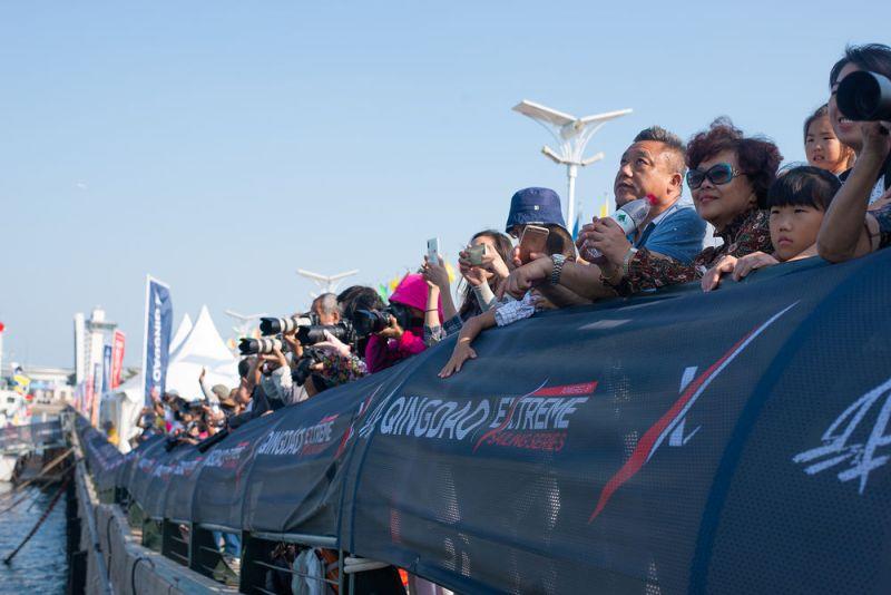 Spectators watched the foiling spectacle from the shore as the fleet of 12 Flying Phantoms battled it out in Fushan Bay, Qingdao - Day 4 - Extreme Sailing Series Qingdao Mazarin Cup photo copyright Patrick Condy taken at  and featuring the Flying Phantom class