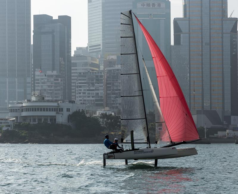 Cariad Trophy - Thornburrow and Partidge leaving the RHKYC behind photo copyright Guy Nowell taken at Royal Hong Kong Yacht Club and featuring the Flying Phantom class
