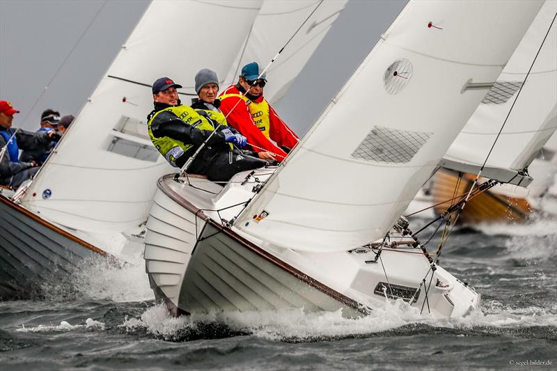 At Kiel Week 2018 in the yellow jersey of the leaders: German Folkboat Sports Director Sönke Durst at the helm, here with Marc Rokicki and Ulrich Schaefer crewing photo copyright Kieler Woche / ChristianBeeck.de taken at Kieler Yacht Club and featuring the Folkboat class