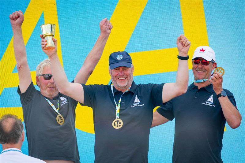 Danish Folkboat Gold Cup winners at  Kieler Woche celebrating: Søren Kæstel, Erik Andersen and Alex Lindegaard photo copyright Sascha Klahn / Kieler Woche  taken at Kieler Yacht Club and featuring the Folkboat class