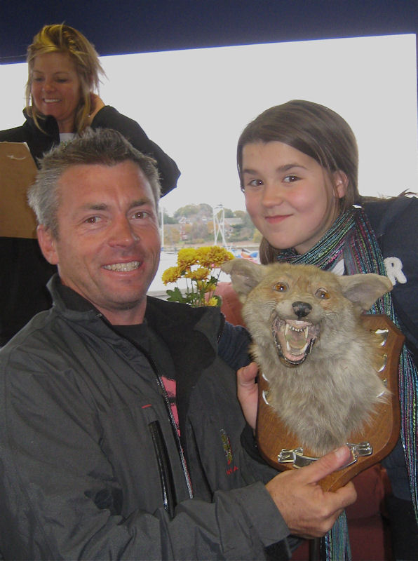 Nicole Lovejoy presenting the Foxer Winter Championship trophy to Rob Greenhalgh photo copyright Malcolm Donald taken at Hamble River Sailing Club and featuring the Foxer class
