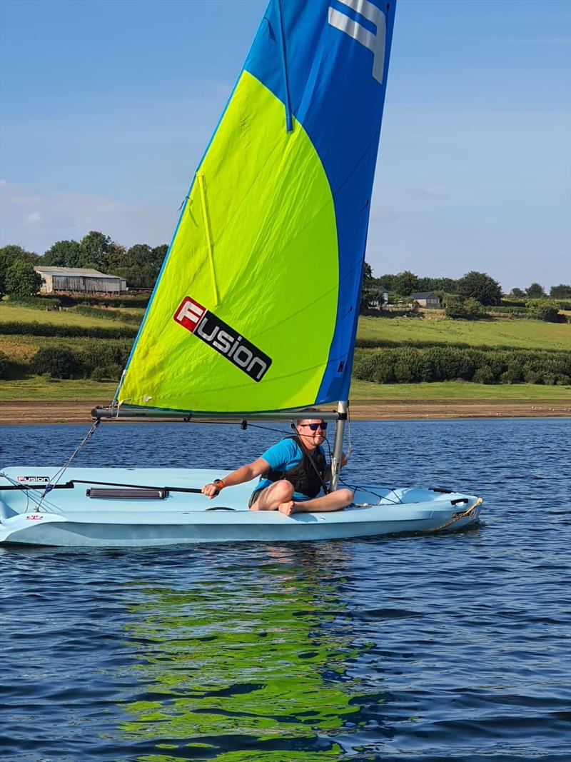 Luke Hoather, Centre Manager, putting his light wind sailing skills to the test during the Wimbleball Lake Staff Fusion Regatta photo copyright Maddy Shaw taken at Wimbleball Sailing Club and featuring the Fusion class