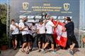 A jubliant Black Star Sailing Team crew at this evening's prizegiving in the Lagos GC32 Worlds © Sailing Energy / GC32 Racing Tour