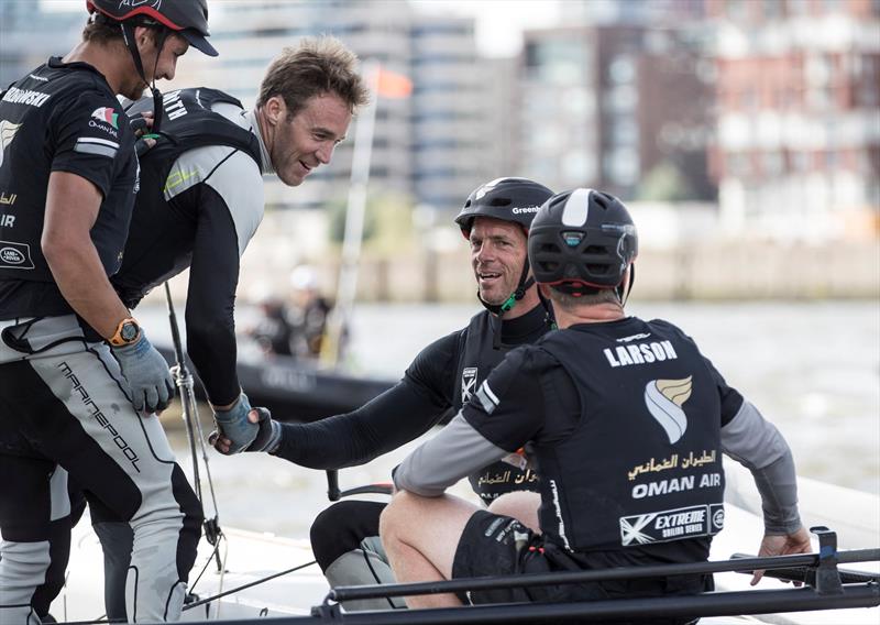 Oman Air congratulate each other after a tense double-points final race at Extreme Sailing Series™ Act 4, Hamburg photo copyright Mark Lloyd / www.lloydimages.com taken at  and featuring the GC32 class