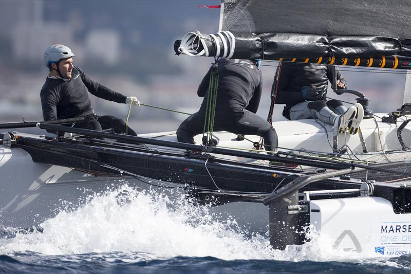 Jason Carroll multi-tasks on Argo on day 4 of the GC32 Racing Tour at the Marseille One Design - photo © Sander van der Borch / GC32 Racing Tour