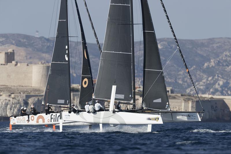 American Jason Carroll's Argo leads Simon Delzoppo's .film Racing from Australia in training on the Marseille One Design Practice Day photo copyright Gilles Martin-Raget / GC32 Racing Tour taken at  and featuring the GC32 class
