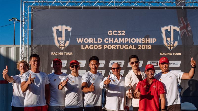 Mr Hu Bing with the ChinaOne.Ningbo team during the GC32 World Championship in Lagos, Portugal photo copyright Drew Malcolm / ChinaONE.Ningbo taken at  and featuring the GC32 class