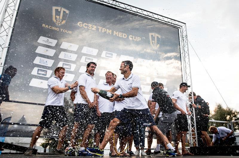 Franck Cammas dowses his NORAUTO team at the GC32 TPM Med Cup - photo © Sailing Energy / GC32 Racing Tour