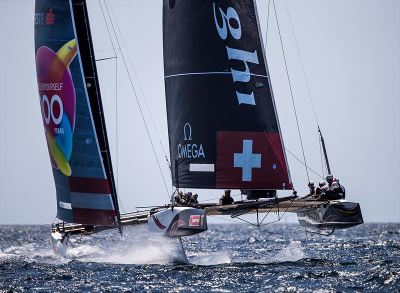Red Bull Sailing Team in the wake of the immaculate Alinghi. - Copa del Rey MAPFRE photo copyright Tomas Moya / Sailing Energy / World Sailing / GC32 Racing Tour taken at Real Club Náutico de Palma and featuring the GC32 class